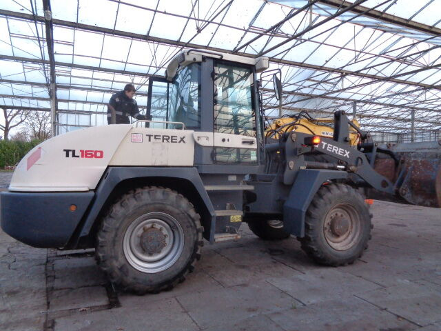 Terex TL160 - Utovarivač na kotačima: slika Terex TL160 - Utovarivač na kotačima Terex TL160 - Utovarivač na kotačima: slika Terex TL160 - Utovarivač na kotačima