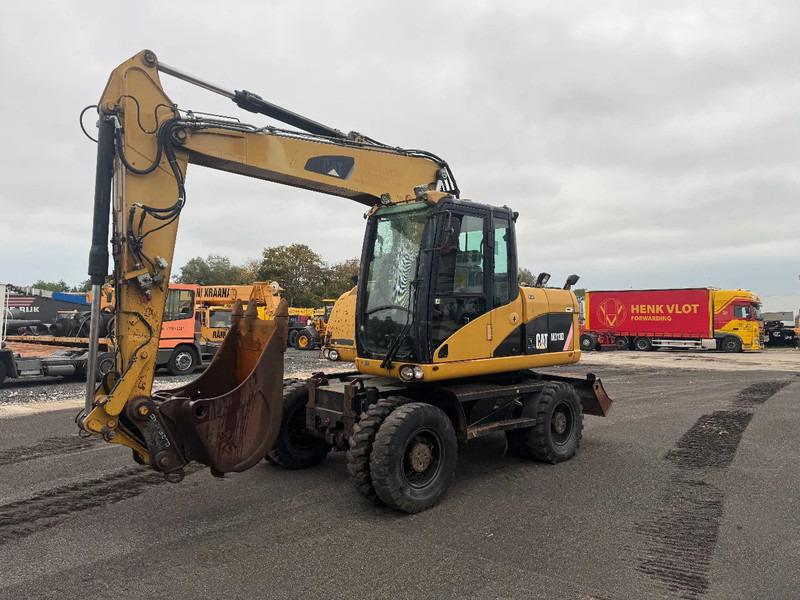 Caterpillar M313D 7212 HOURS - Bager na kotačima: slika Caterpillar M313D 7212 HOURS - Bager na kotačima Caterpillar M313D 7212 HOURS - Bager na kotačima: slika Caterpillar M313D 7212 HOURS - Bager na kotačima
