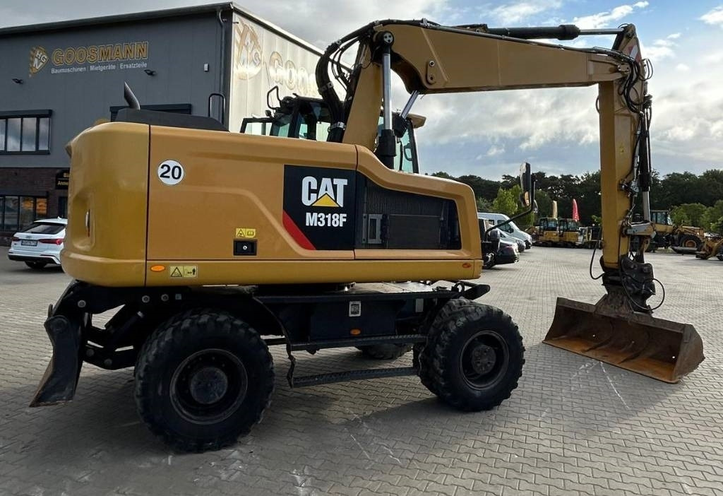CAT M 318 F - Bager na kotačima: slika CAT M 318 F - Bager na kotačima CAT M 318 F - Bager na kotačima: slika CAT M 318 F - Bager na kotačima
