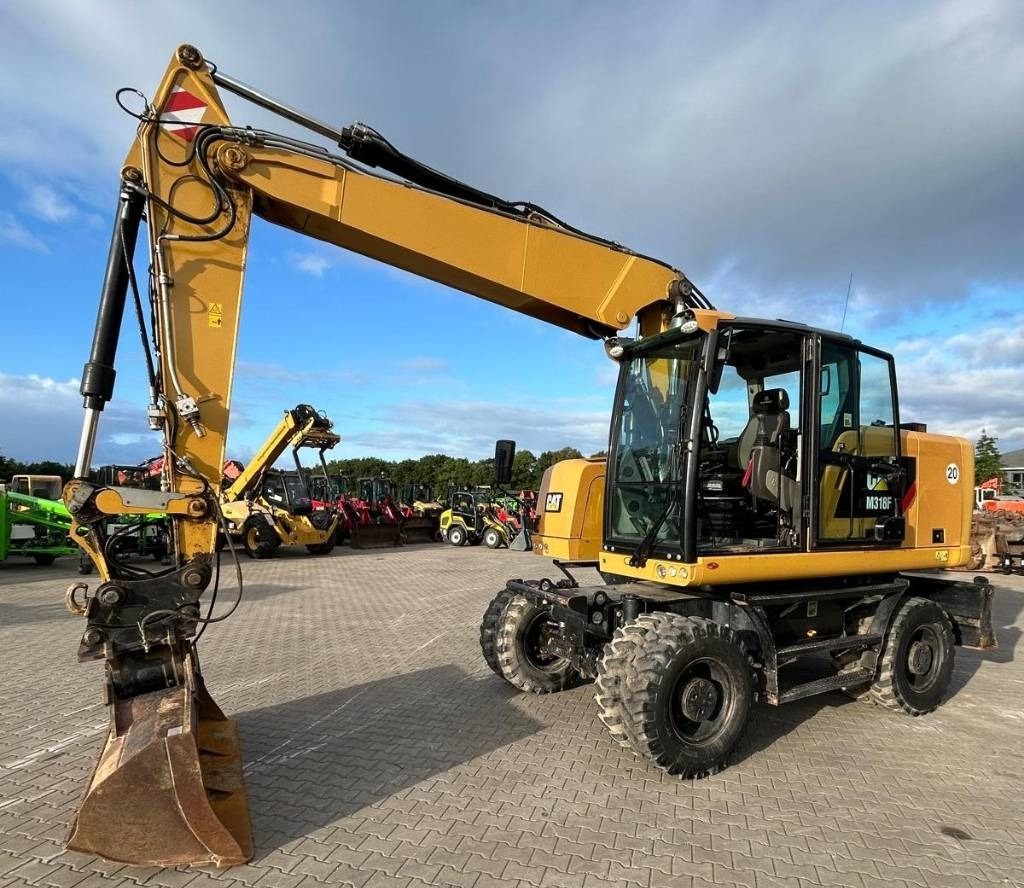 Bager na kotačima CAT M 318 F: slika Bager na kotačima CAT M 318 F Bager na kotačima CAT M 318 F: slika Bager na kotačima CAT M 318 F