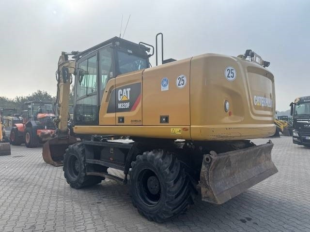CAT M 320 F - Bager na kotačima: slika CAT M 320 F - Bager na kotačima CAT M 320 F - Bager na kotačima: slika CAT M 320 F - Bager na kotačima