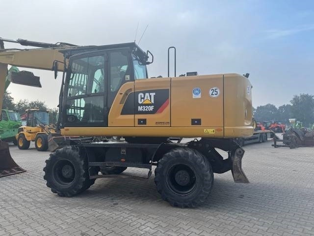 CAT M 320 F - Bager na kotačima: slika CAT M 320 F - Bager na kotačima CAT M 320 F - Bager na kotačima: slika CAT M 320 F - Bager na kotačima