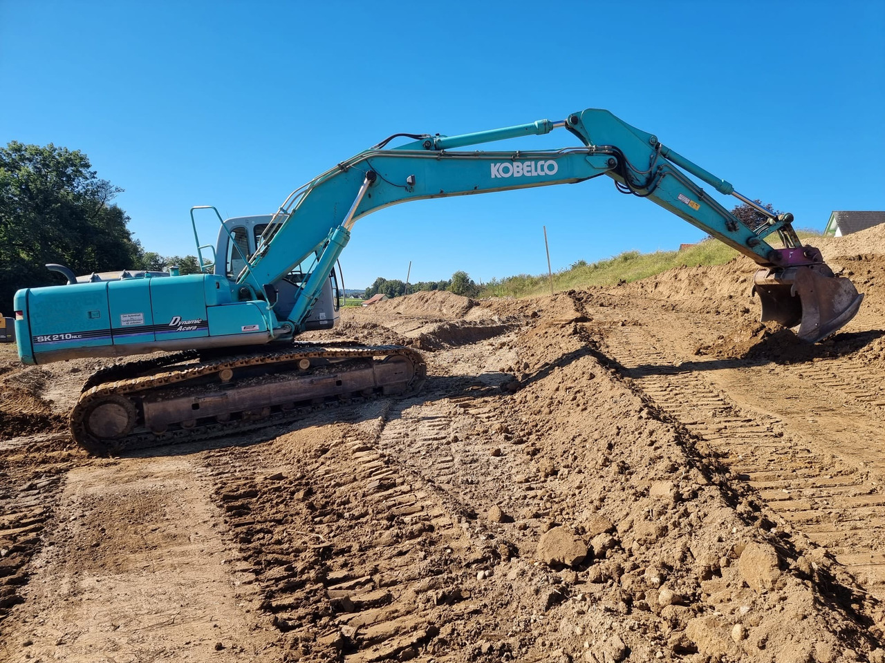 KOBELCO SK 210 NLC-6E - Bager gusjeničar: slika KOBELCO SK 210 NLC-6E - Bager gusjeničar KOBELCO SK 210 NLC-6E - Bager gusjeničar: slika KOBELCO SK 210 NLC-6E - Bager gusjeničar