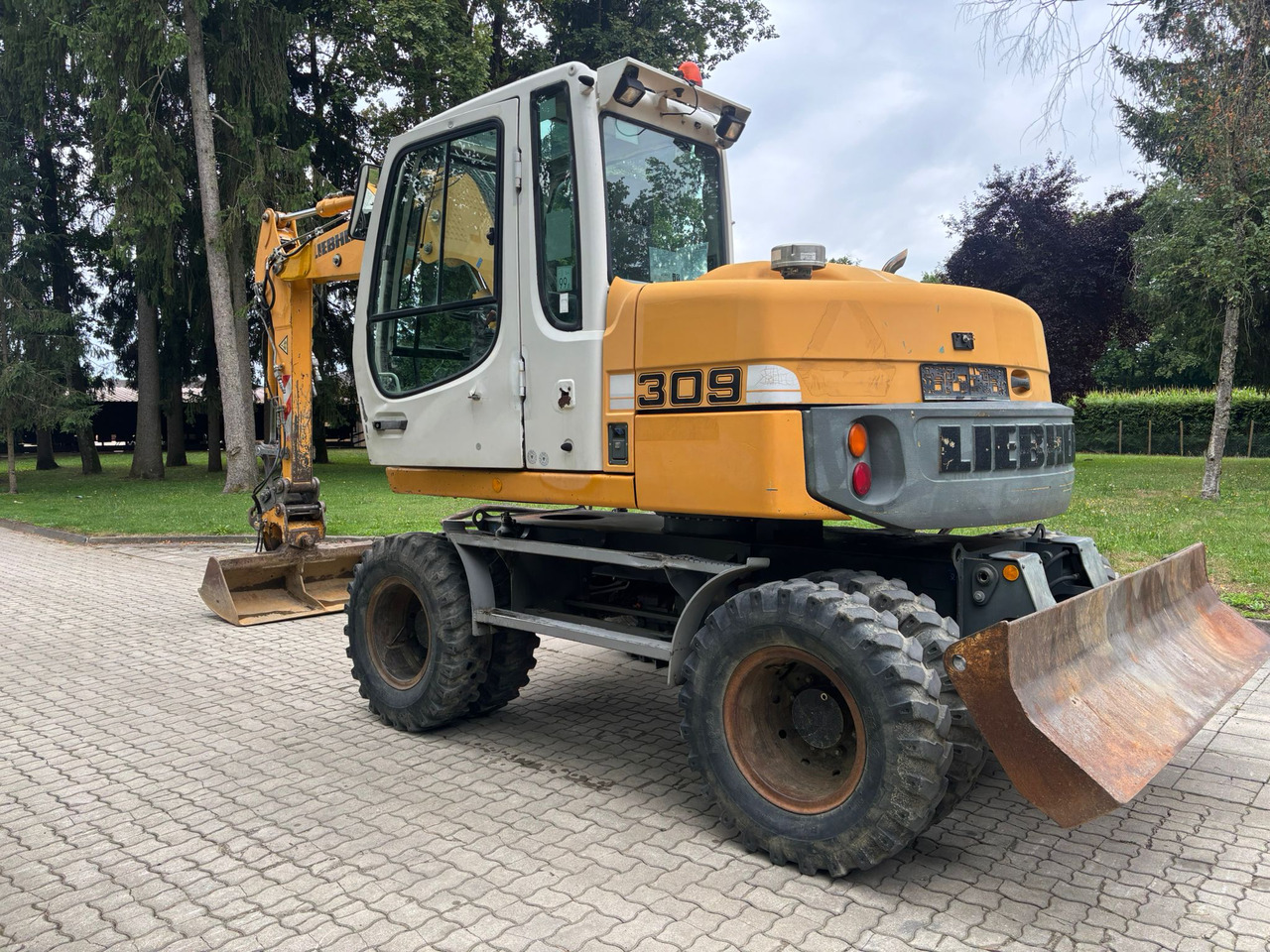 LIEBHERR A 309 Litronic - Bager na kotačima: slika LIEBHERR A 309 Litronic - Bager na kotačima LIEBHERR A 309 Litronic - Bager na kotačima: slika LIEBHERR A 309 Litronic - Bager na kotačima