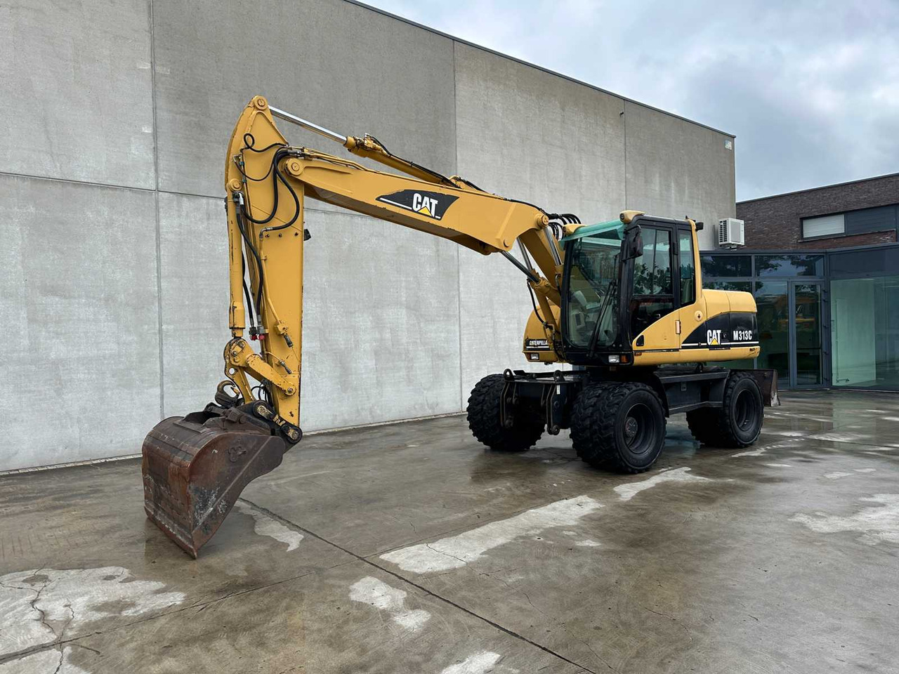 Caterpillar M313C - Bager na kotačima: slika Caterpillar M313C - Bager na kotačima Caterpillar M313C - Bager na kotačima: slika Caterpillar M313C - Bager na kotačima