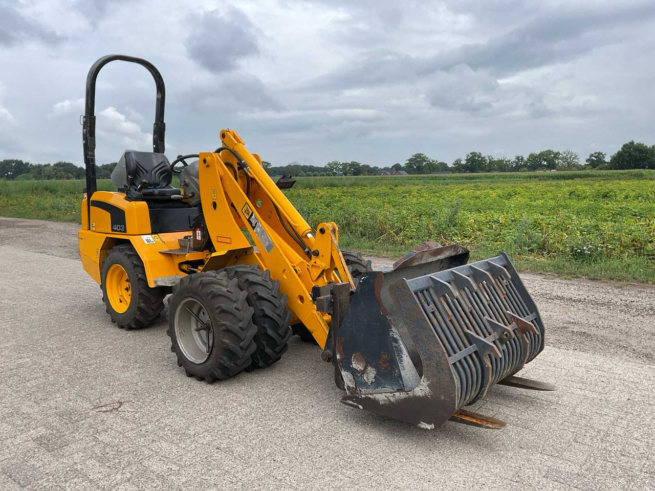 JCB 403 - Utovarivač na kotačima: slika JCB 403 - Utovarivač na kotačima JCB 403 - Utovarivač na kotačima: slika JCB 403 - Utovarivač na kotačima