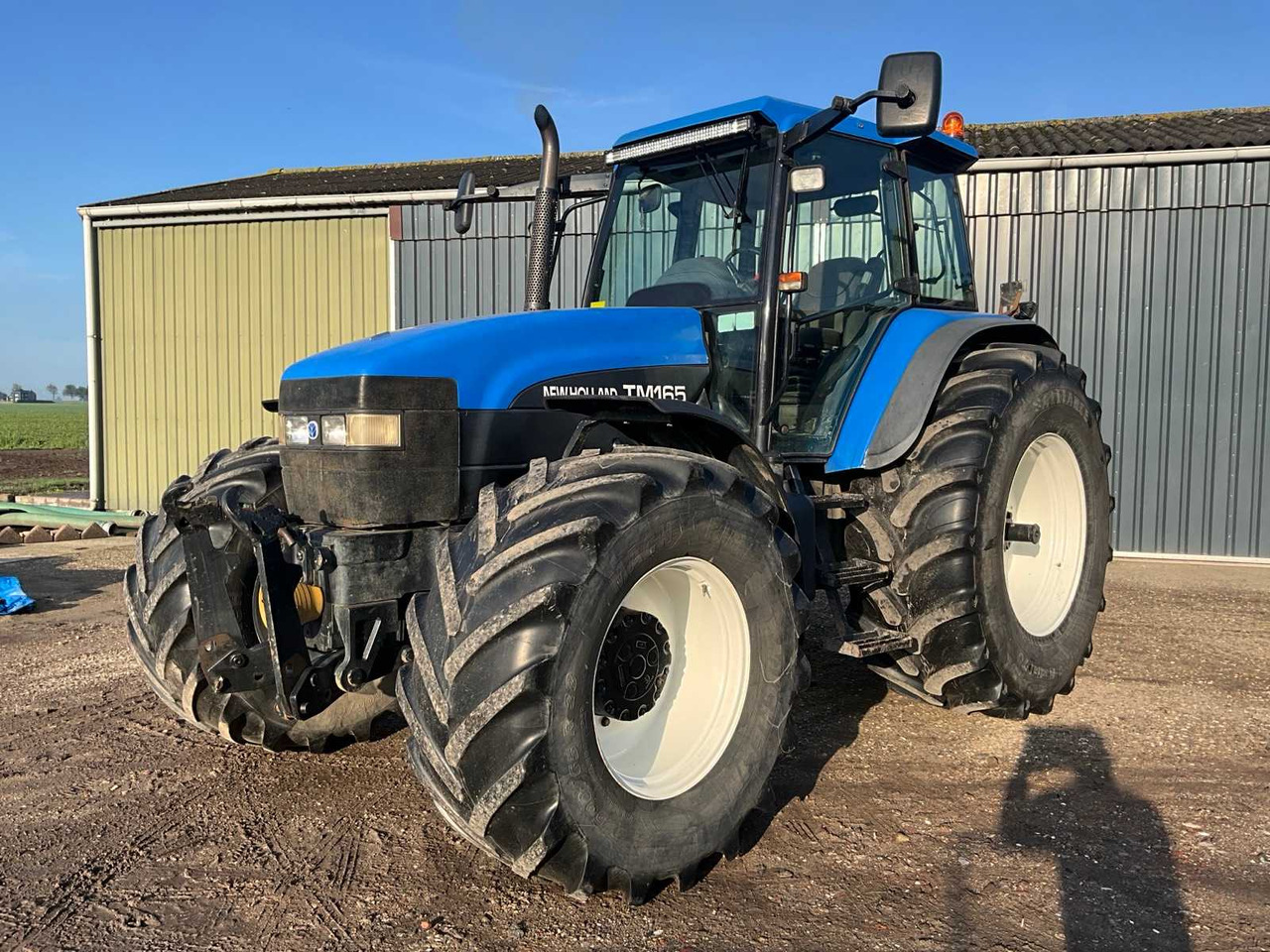 New Holland TM165 - Traktor: slika New Holland TM165 - Traktor New Holland TM165 - Traktor: slika New Holland TM165 - Traktor
