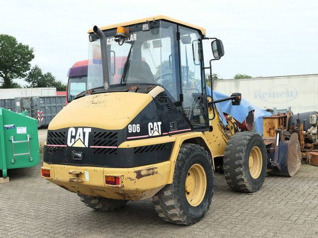CAT 906, Hydr. S.W.S., Greifschaufel, - Utovarivač na kotačima: slika CAT 906, Hydr. S.W.S., Greifschaufel, - Utovarivač na kotačima CAT 906, Hydr. S.W.S., Greifschaufel, - Utovarivač na kotačima: slika CAT 906, Hydr. S.W.S., Greifschaufel, - Utovarivač na kotačima