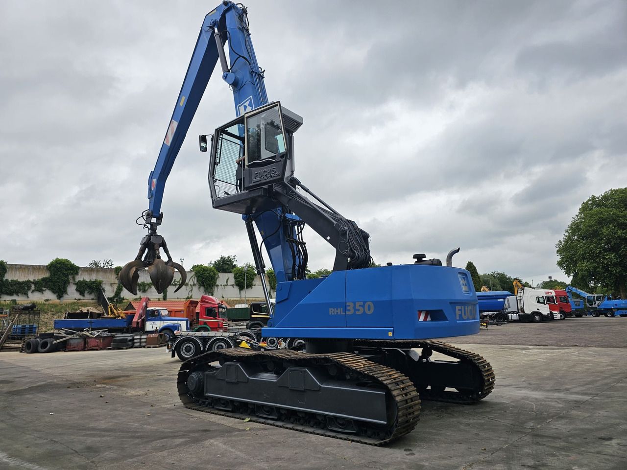 Fuchs RHL 350 Materialhandler With Adjustable Tracks - Stroj za rukovanje otpadom: slika Fuchs RHL 350 Materialhandler With Adjustable Tracks - Stroj za rukovanje otpadom Fuchs RHL 350 Materialhandler With Adjustable Tracks - Stroj za rukovanje otpadom: slika Fuchs RHL 350 Materialhandler With Adjustable Tracks - Stroj za rukovanje otpadom