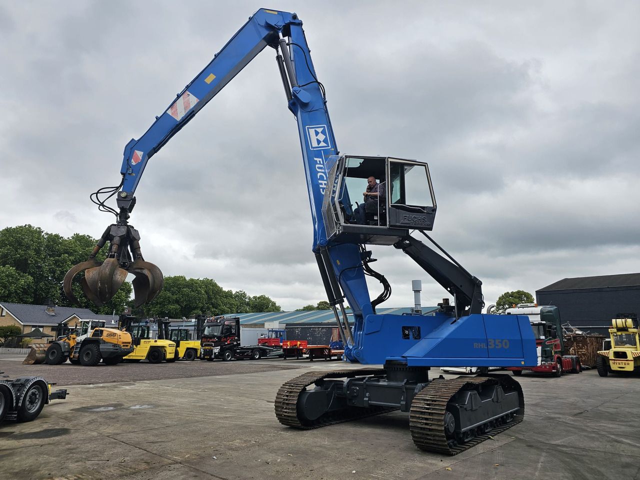 Fuchs RHL 350 Materialhandler With Adjustable Tracks - Stroj za rukovanje otpadom: slika Fuchs RHL 350 Materialhandler With Adjustable Tracks - Stroj za rukovanje otpadom Fuchs RHL 350 Materialhandler With Adjustable Tracks - Stroj za rukovanje otpadom: slika Fuchs RHL 350 Materialhandler With Adjustable Tracks - Stroj za rukovanje otpadom