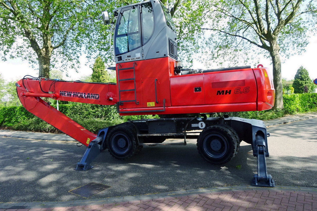 New Holland MH 6.6 Materialhandler With Magnet System - Stroj za rukovanje otpadom: slika New Holland MH 6.6 Materialhandler With Magnet System - Stroj za rukovanje otpadom New Holland MH 6.6 Materialhandler With Magnet System - Stroj za rukovanje otpadom: slika New Holland MH 6.6 Materialhandler With Magnet System - Stroj za rukovanje otpadom