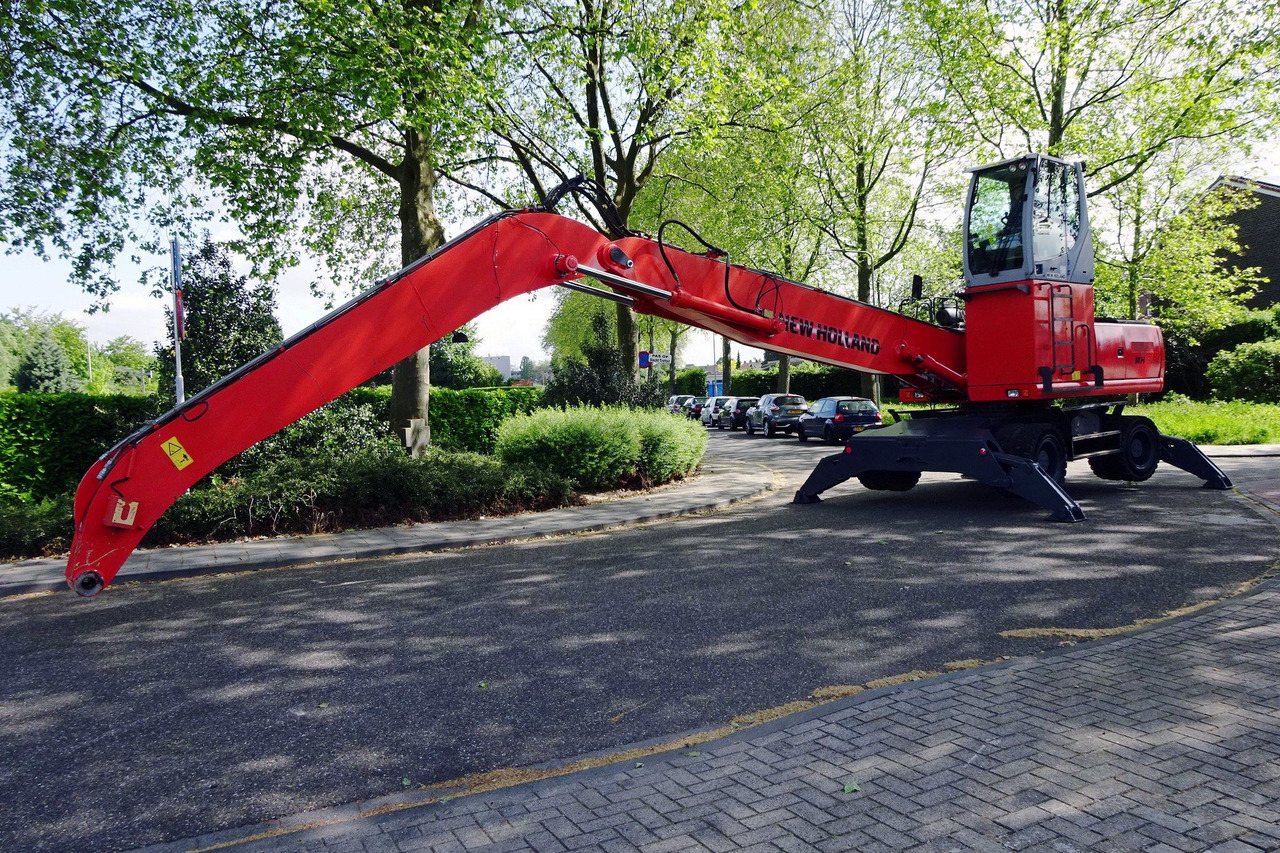 New Holland MH 6.6 Materialhandler With Magnet System - Stroj za rukovanje otpadom: slika New Holland MH 6.6 Materialhandler With Magnet System - Stroj za rukovanje otpadom New Holland MH 6.6 Materialhandler With Magnet System - Stroj za rukovanje otpadom: slika New Holland MH 6.6 Materialhandler With Magnet System - Stroj za rukovanje otpadom