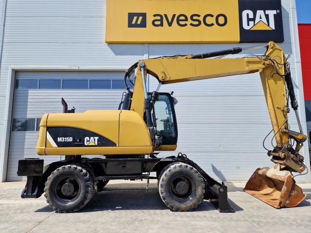 CATERPILLAR M315 - Bager na kotačima: slika CATERPILLAR M315 - Bager na kotačima CATERPILLAR M315 - Bager na kotačima: slika CATERPILLAR M315 - Bager na kotačima