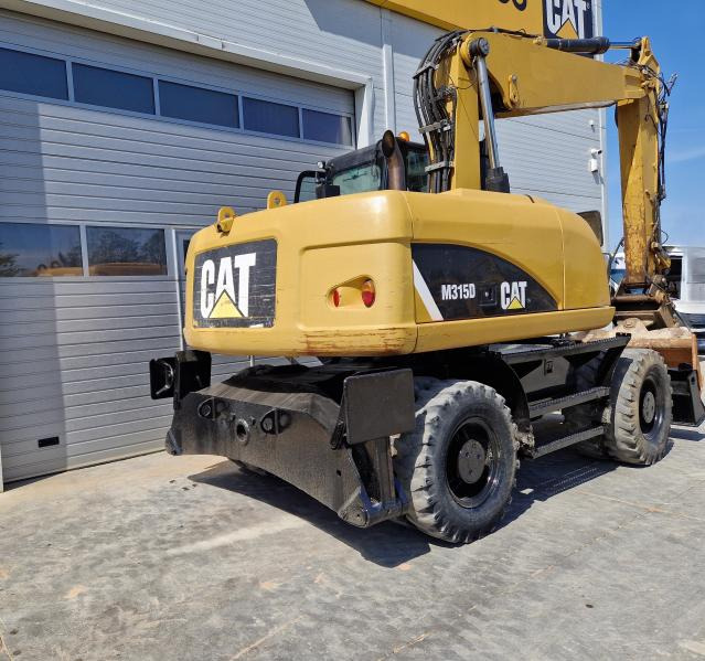 CATERPILLAR M315 - Bager na kotačima: slika CATERPILLAR M315 - Bager na kotačima CATERPILLAR M315 - Bager na kotačima: slika CATERPILLAR M315 - Bager na kotačima