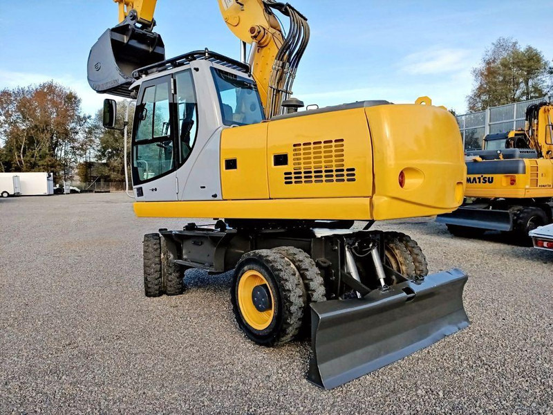 New Holland WE 190 - Bager na kotačima: slika New Holland WE 190 - Bager na kotačima New Holland WE 190 - Bager na kotačima: slika New Holland WE 190 - Bager na kotačima