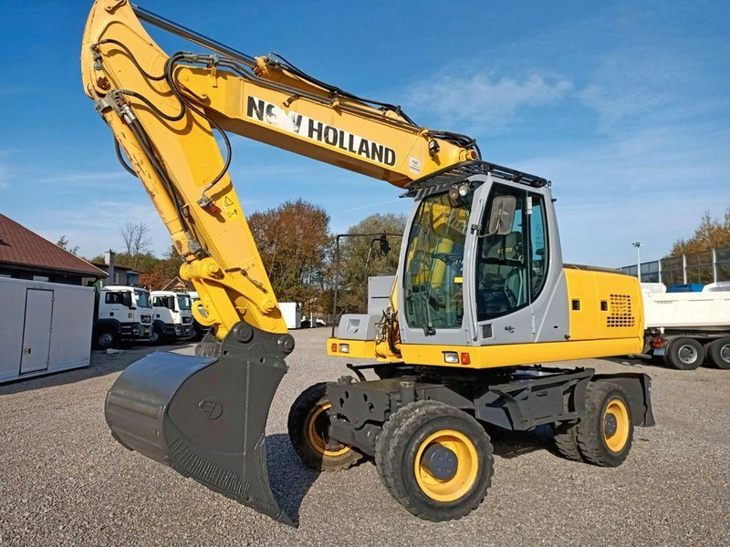 New Holland WE 190 - Bager na kotačima: slika New Holland WE 190 - Bager na kotačima New Holland WE 190 - Bager na kotačima: slika New Holland WE 190 - Bager na kotačima