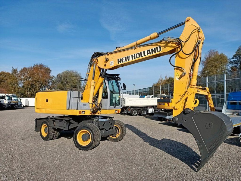 New Holland WE 190 - Bager na kotačima: slika New Holland WE 190 - Bager na kotačima New Holland WE 190 - Bager na kotačima: slika New Holland WE 190 - Bager na kotačima