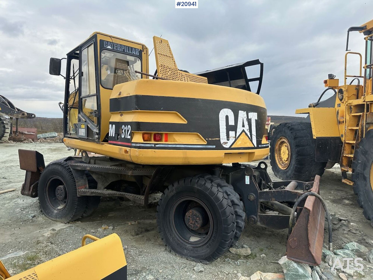 Caterpillar 312 - Bager na kotačima: slika Caterpillar 312 - Bager na kotačima Caterpillar 312 - Bager na kotačima: slika Caterpillar 312 - Bager na kotačima