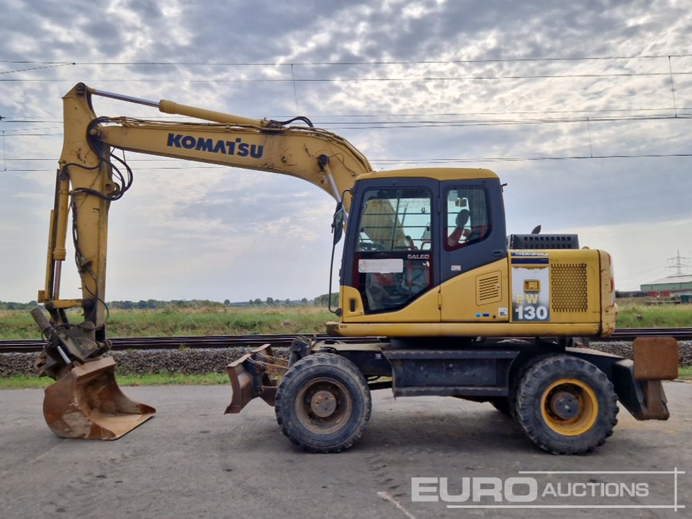 Komatsu PW130-7K - Bager na kotačima: slika Komatsu PW130-7K - Bager na kotačima Komatsu PW130-7K - Bager na kotačima: slika Komatsu PW130-7K - Bager na kotačima