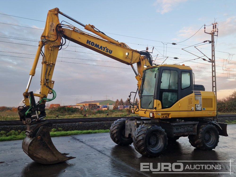 Komatsu PW140-7 - Bager na kotačima: slika Komatsu PW140-7 - Bager na kotačima Komatsu PW140-7 - Bager na kotačima: slika Komatsu PW140-7 - Bager na kotačima