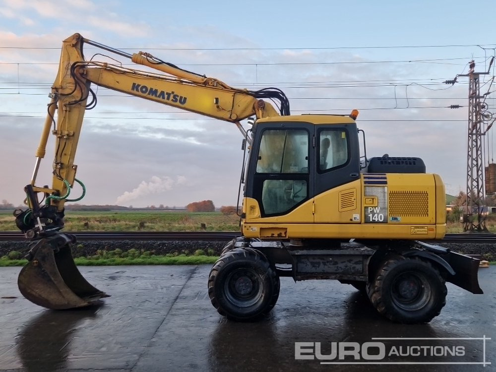 Komatsu PW140-7 - Bager na kotačima: slika Komatsu PW140-7 - Bager na kotačima Komatsu PW140-7 - Bager na kotačima: slika Komatsu PW140-7 - Bager na kotačima
