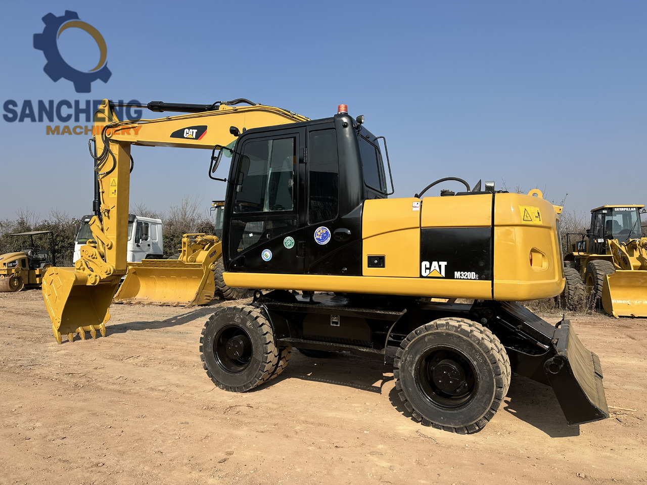 CATERPILLAR M320D2 - Bager na kotačima: slika CATERPILLAR M320D2 - Bager na kotačima CATERPILLAR M320D2 - Bager na kotačima: slika CATERPILLAR M320D2 - Bager na kotačima