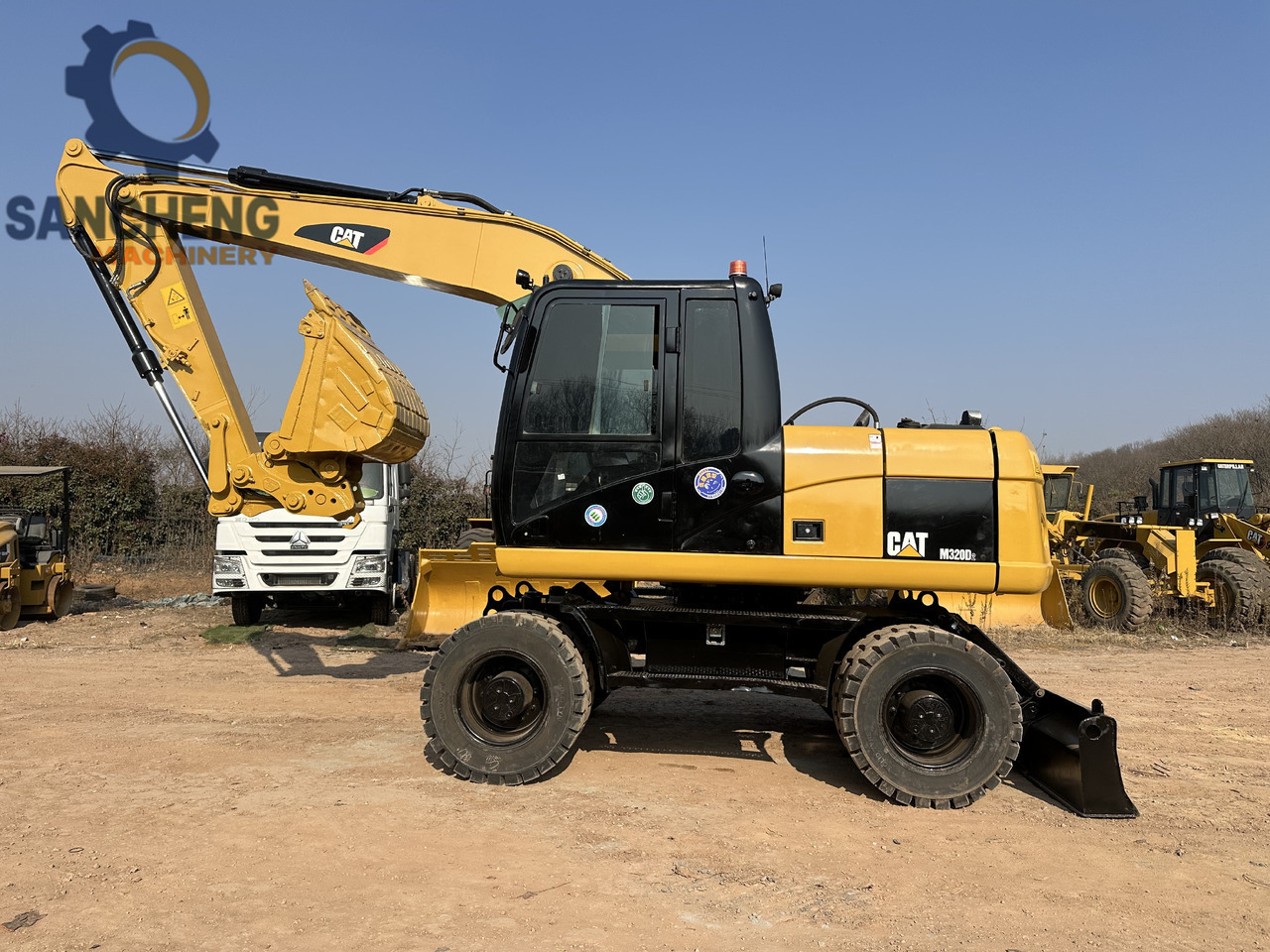 CATERPILLAR M320D2 - Bager na kotačima: slika CATERPILLAR M320D2 - Bager na kotačima CATERPILLAR M320D2 - Bager na kotačima: slika CATERPILLAR M320D2 - Bager na kotačima