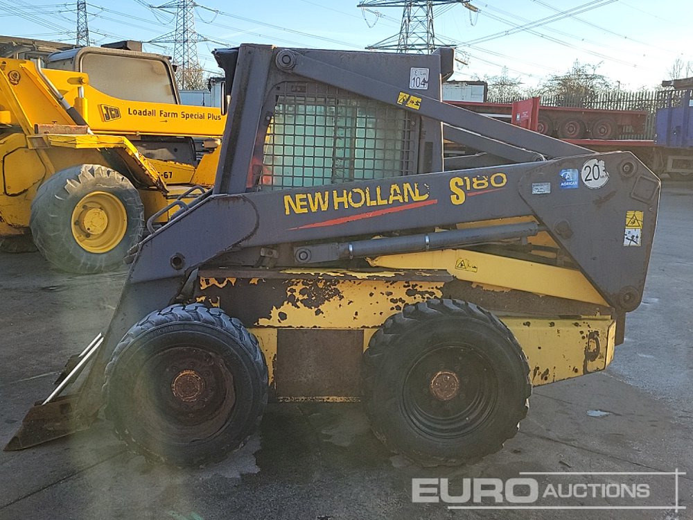 New Holland LS180 - Mini utovarivač: slika New Holland LS180 - Mini utovarivač New Holland LS180 - Mini utovarivač: slika New Holland LS180 - Mini utovarivač