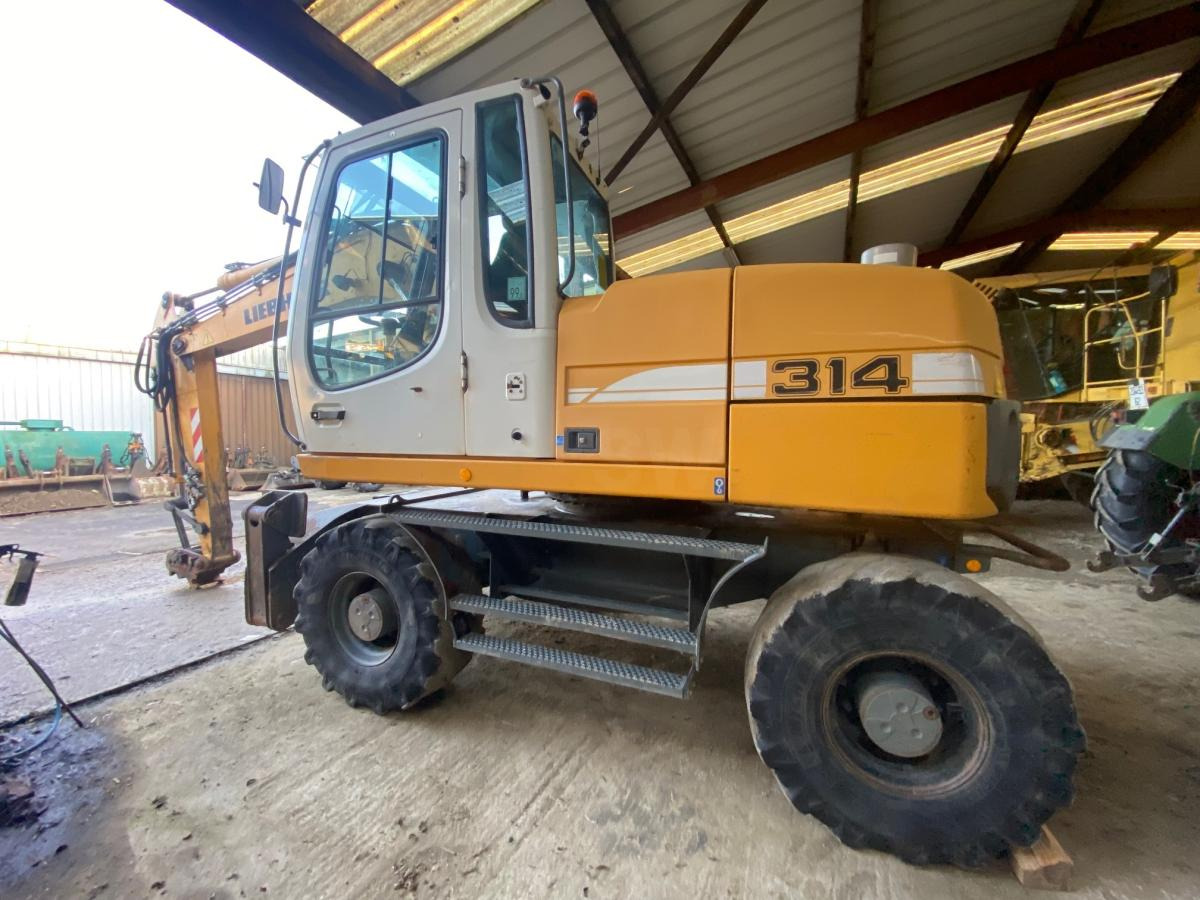 Liebherr A314 Litronic - Bager na kotačima: slika Liebherr A314 Litronic - Bager na kotačima Liebherr A314 Litronic - Bager na kotačima: slika Liebherr A314 Litronic - Bager na kotačima