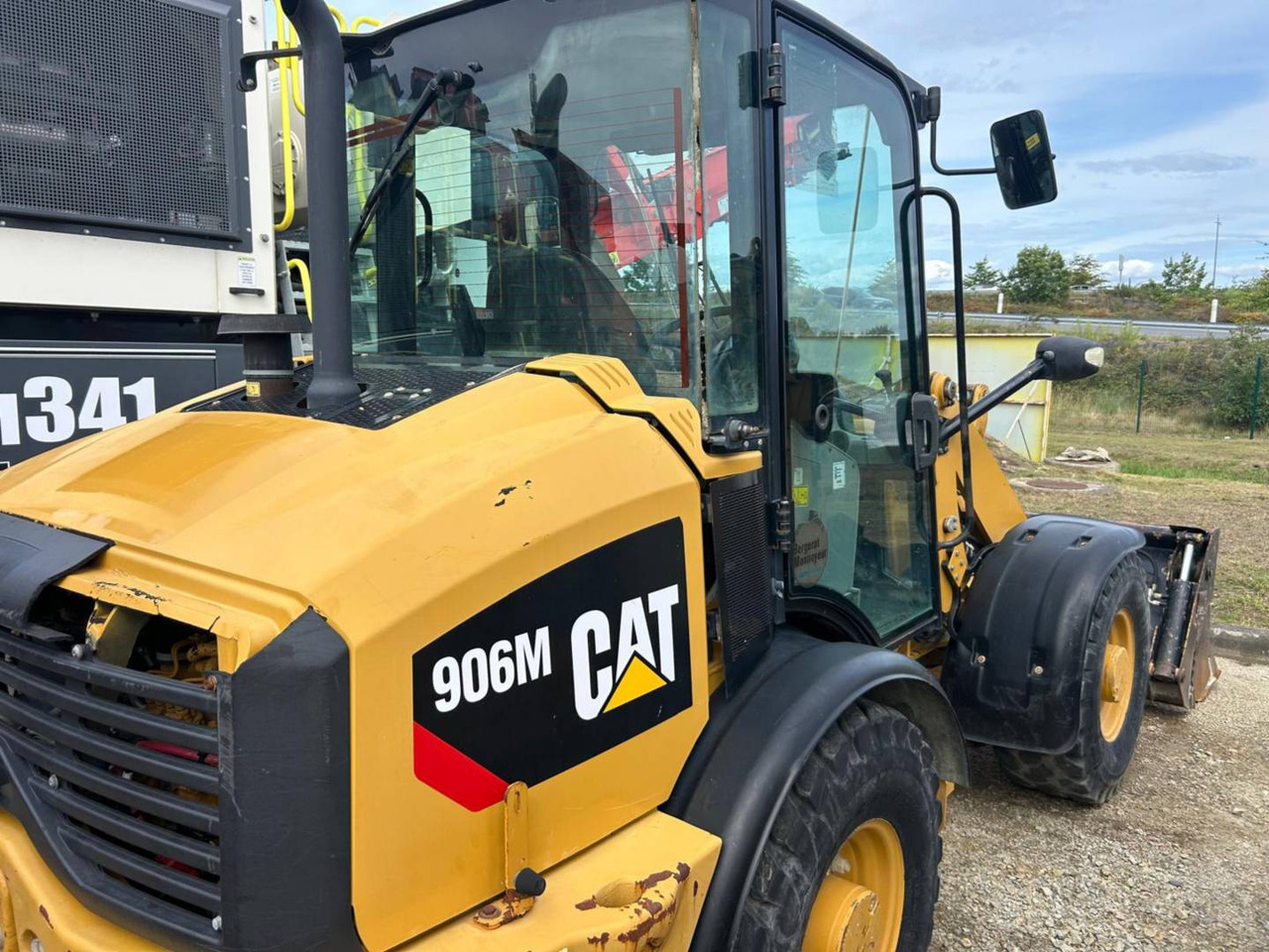 CAT 906M - Utovarivač na kotačima: slika CAT 906M - Utovarivač na kotačima CAT 906M - Utovarivač na kotačima: slika CAT 906M - Utovarivač na kotačima