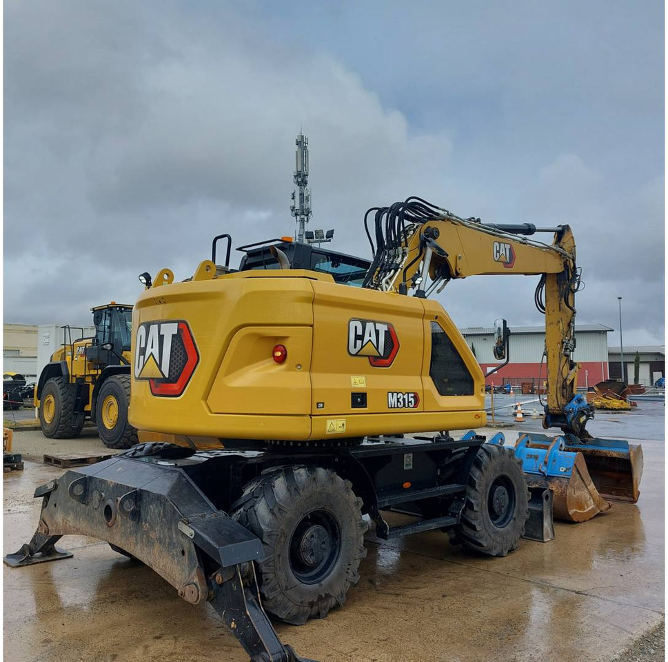 CAT M315 - Bager na kotačima: slika CAT M315 - Bager na kotačima CAT M315 - Bager na kotačima: slika CAT M315 - Bager na kotačima