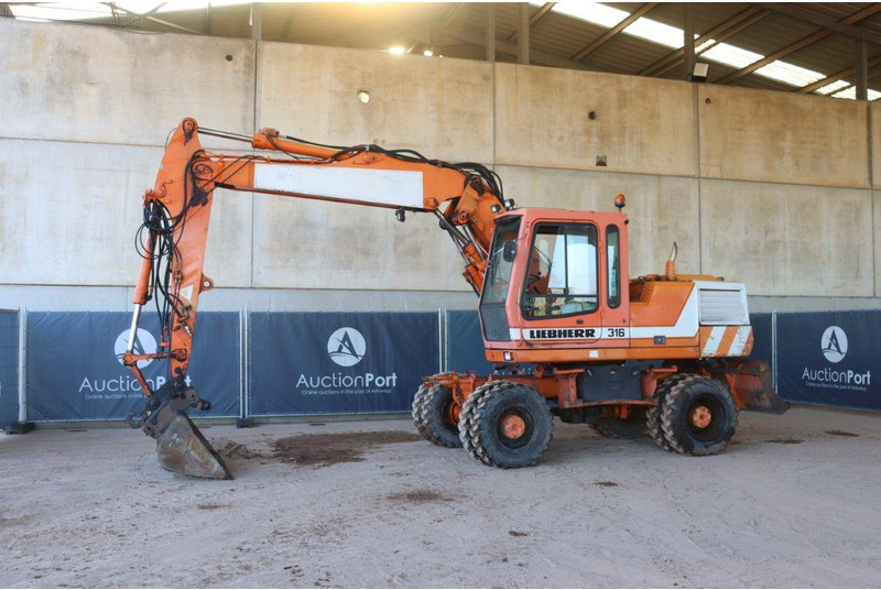 Liebherr A316 - Bager na kotačima: slika Liebherr A316 - Bager na kotačima Liebherr A316 - Bager na kotačima: slika Liebherr A316 - Bager na kotačima