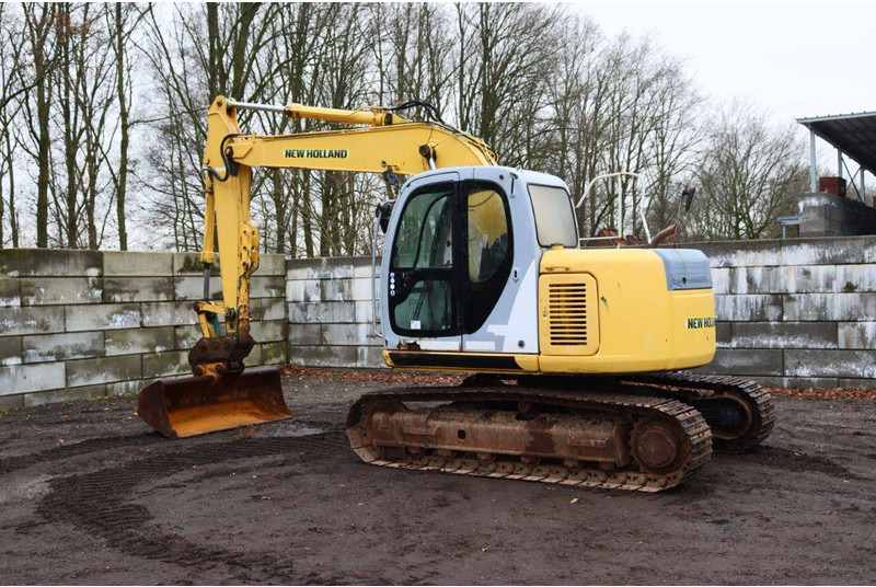 New Holland E115SR - Bager gusjeničar: slika New Holland E115SR - Bager gusjeničar New Holland E115SR - Bager gusjeničar: slika New Holland E115SR - Bager gusjeničar