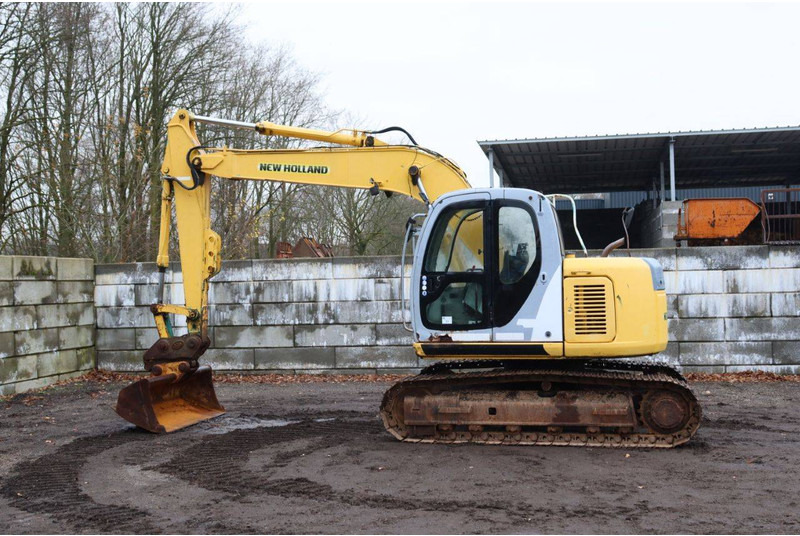 New Holland E115SR - Bager gusjeničar: slika New Holland E115SR - Bager gusjeničar New Holland E115SR - Bager gusjeničar: slika New Holland E115SR - Bager gusjeničar