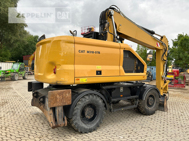Cat M318-07A - Bager na kotačima: slika Cat M318-07A - Bager na kotačima Cat M318-07A - Bager na kotačima: slika Cat M318-07A - Bager na kotačima