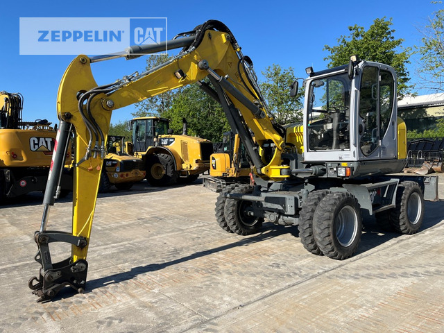 Neuson EW100 - Bager na kotačima: slika Neuson EW100 - Bager na kotačima Neuson EW100 - Bager na kotačima: slika Neuson EW100 - Bager na kotačima