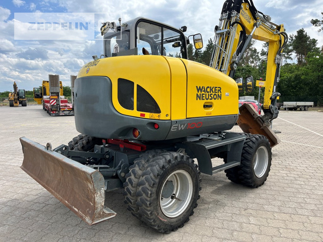 Wacker EW100 - Bager na kotačima: slika Wacker EW100 - Bager na kotačima Wacker EW100 - Bager na kotačima: slika Wacker EW100 - Bager na kotačima