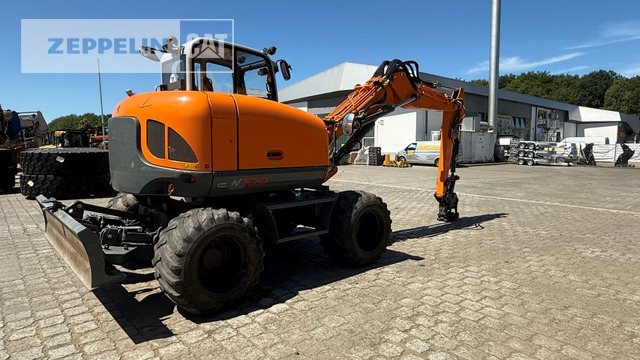 Wacker EW100 - Bager na kotačima: slika Wacker EW100 - Bager na kotačima Wacker EW100 - Bager na kotačima: slika Wacker EW100 - Bager na kotačima