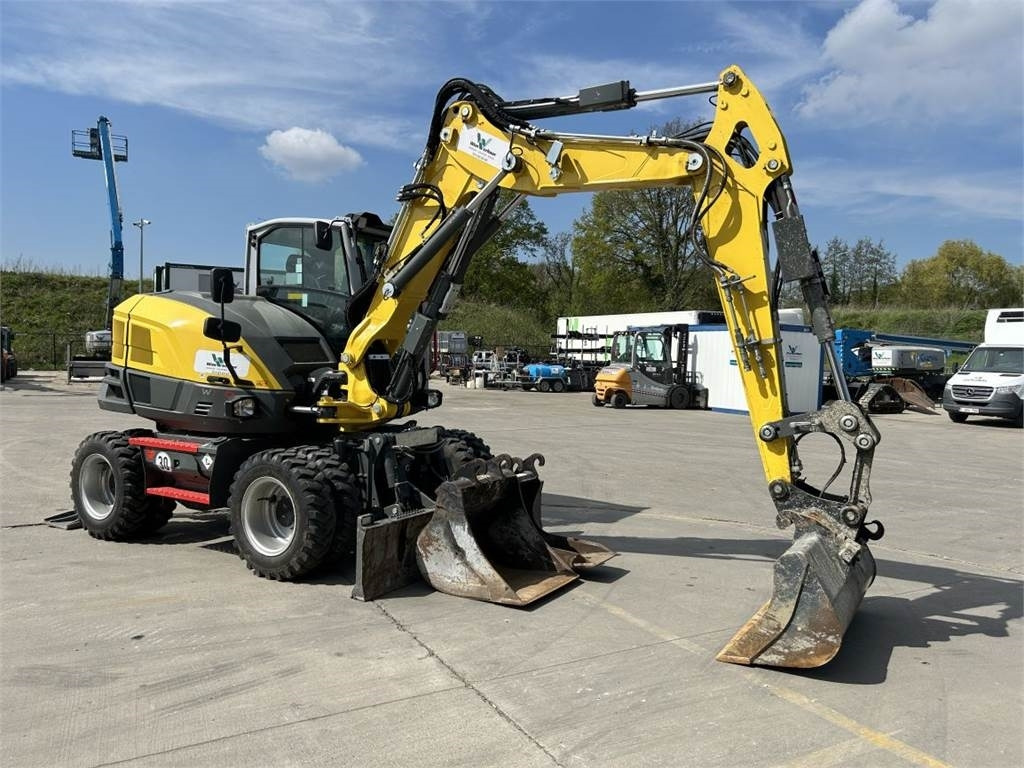 Neuson Wacker Neuson EW100 (9020) - Bager na kotačima: slika Neuson Wacker Neuson EW100 (9020) - Bager na kotačima Neuson Wacker Neuson EW100 (9020) - Bager na kotačima: slika Neuson Wacker Neuson EW100 (9020) - Bager na kotačima